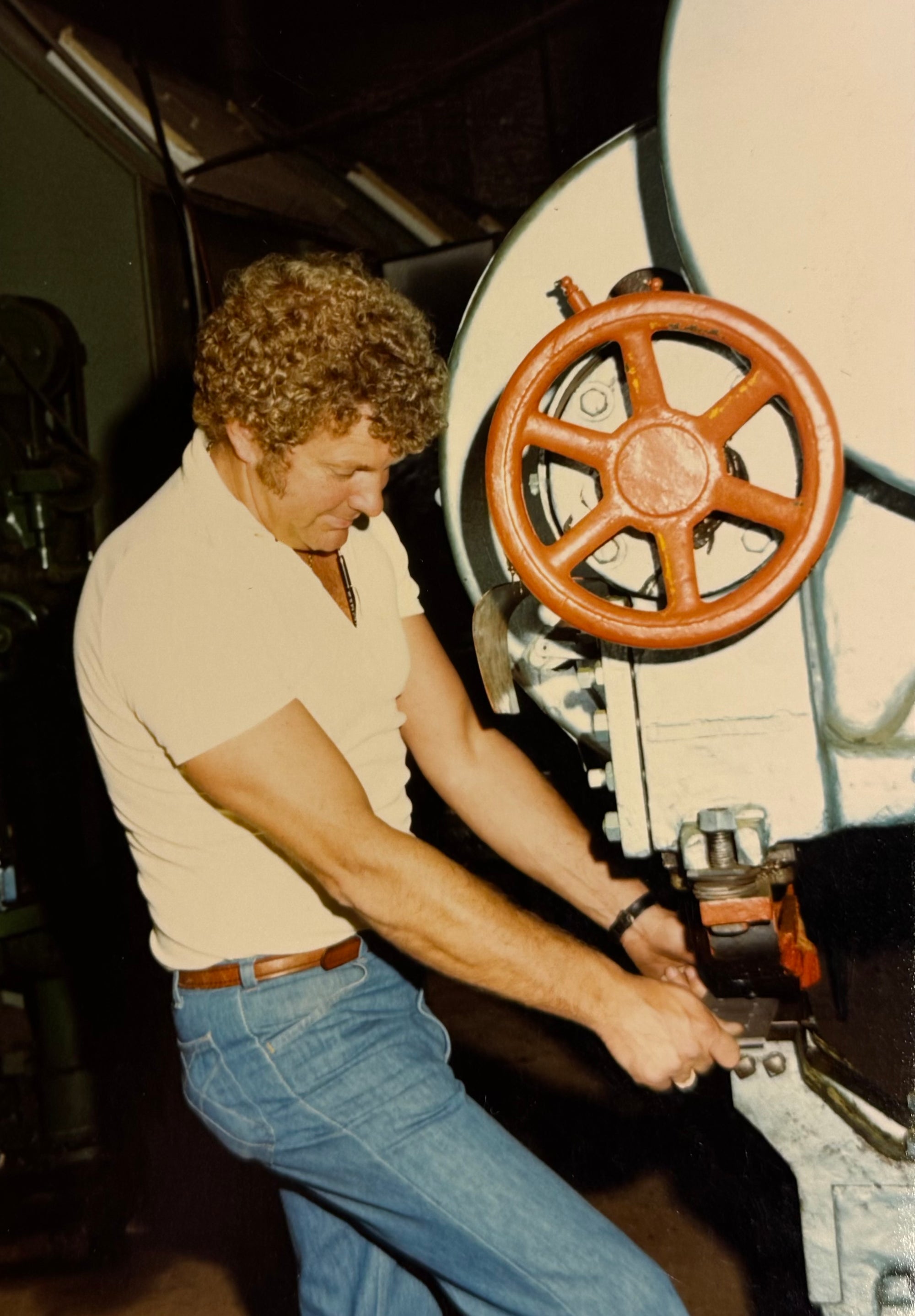 Former Nippa Sauna Stove owner Gil Kotila operating manufacturing equipment at the previous factory in Bruce Crossing Michigan