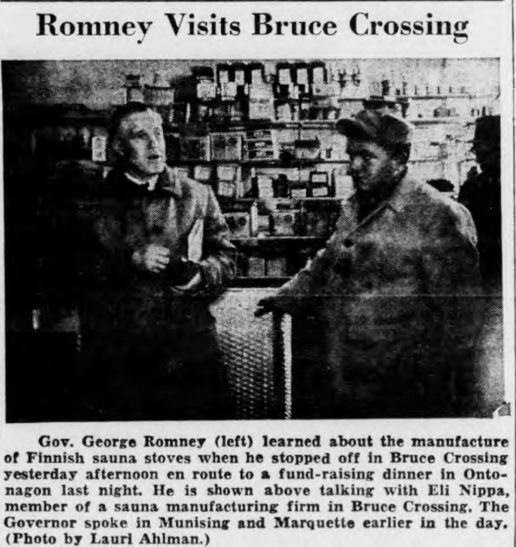 Governor George Romney speaking with Eli Nippa at the Nippa sauna stove manufacturing facility in Bruce Crossing Michigan